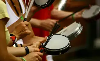 people having drumming lesson