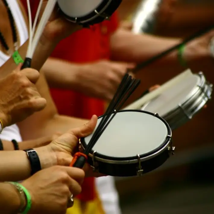 people having drumming lesson