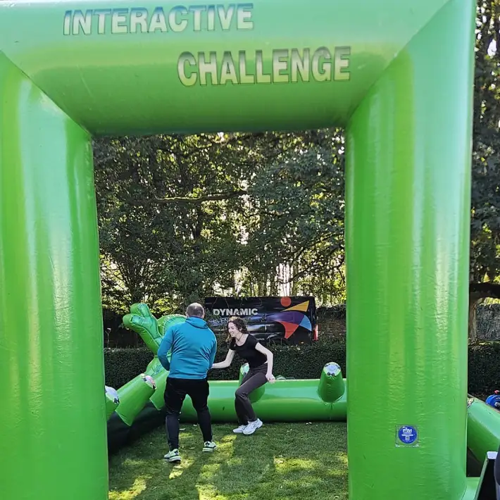 Resmed PEI employees taking part in an inflatable team-building challenge during Team Olympics at The Johnstown Estate.