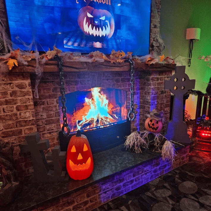 fireplace with pumpkin and Alexions sign above