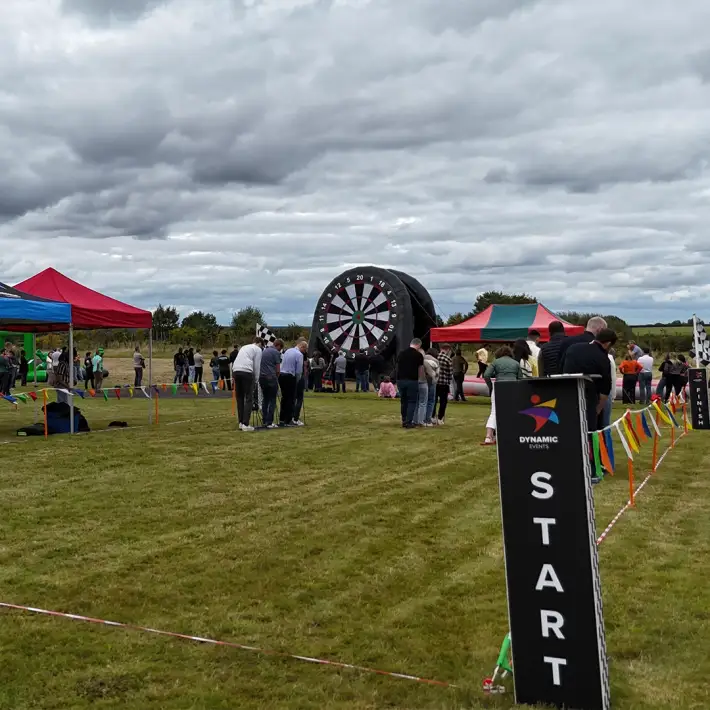 Moore Ireland employees competing in group ski challenge during outdoor Team Olympics organised by Dynamic Events Ireland in Killenard