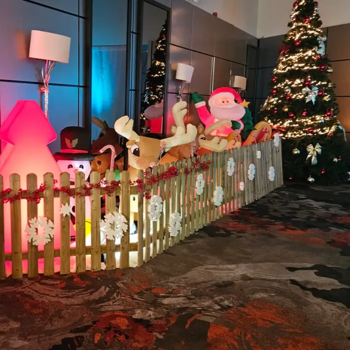 Santa reindeer decorations beside the tree