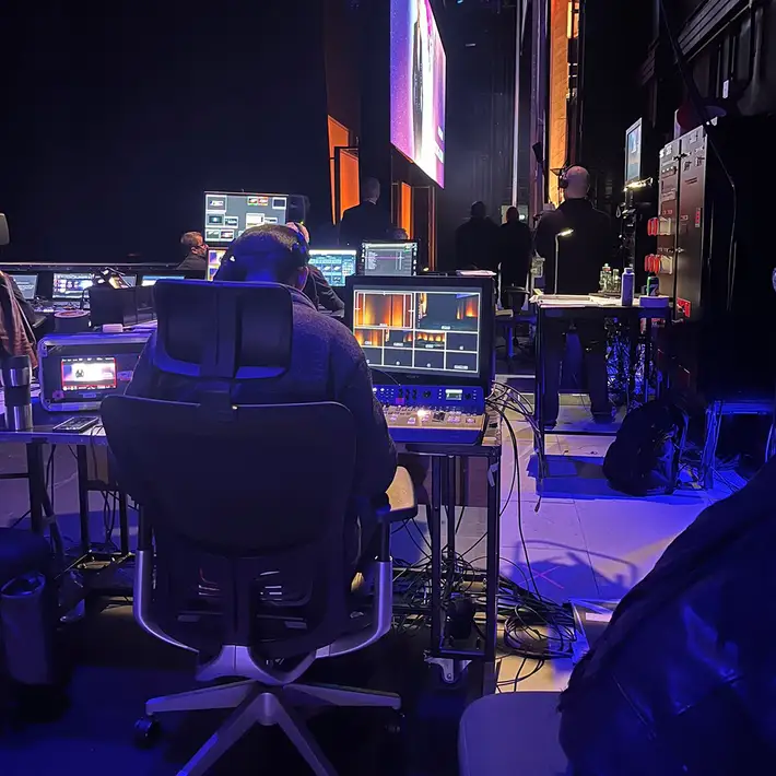 A view from the production control area backstage, showing the technical operations driving the event’s polished execution.