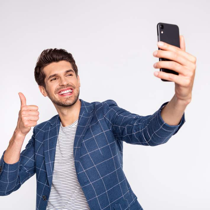 man takes selfie