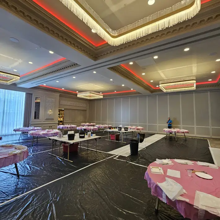 Big Picture team building room setup at Johnstown Estate with painting tables prepared for Coca-Cola’s 50th anniversary event in Ireland.