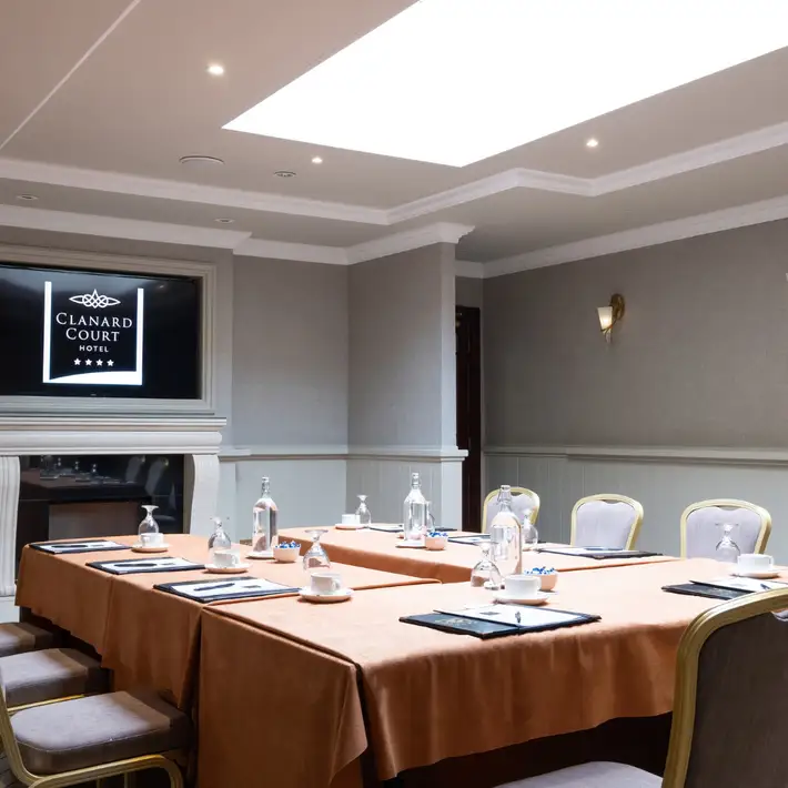 U shaped table set up in a boardroom