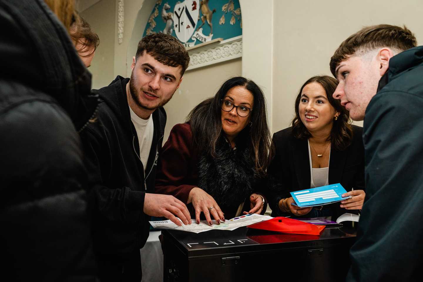 team doing indoor team building activity in ireland as part of their kick off event