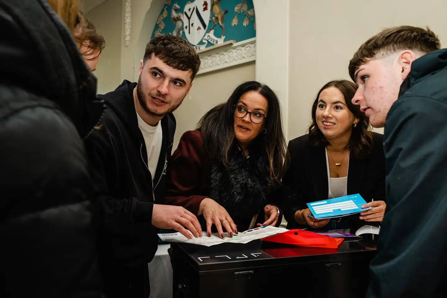 team doing indoor team building activity in ireland as part of their kick off event