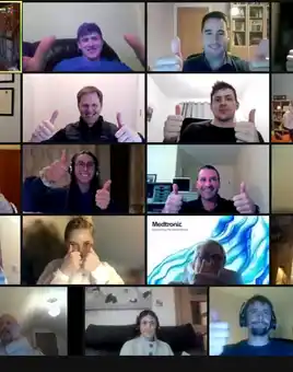 Corporate team giving thumbs up during virtual team building activity on Zoom