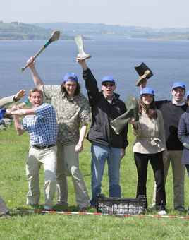 Corporate team outdoors celebrating after Irish-themed team building games