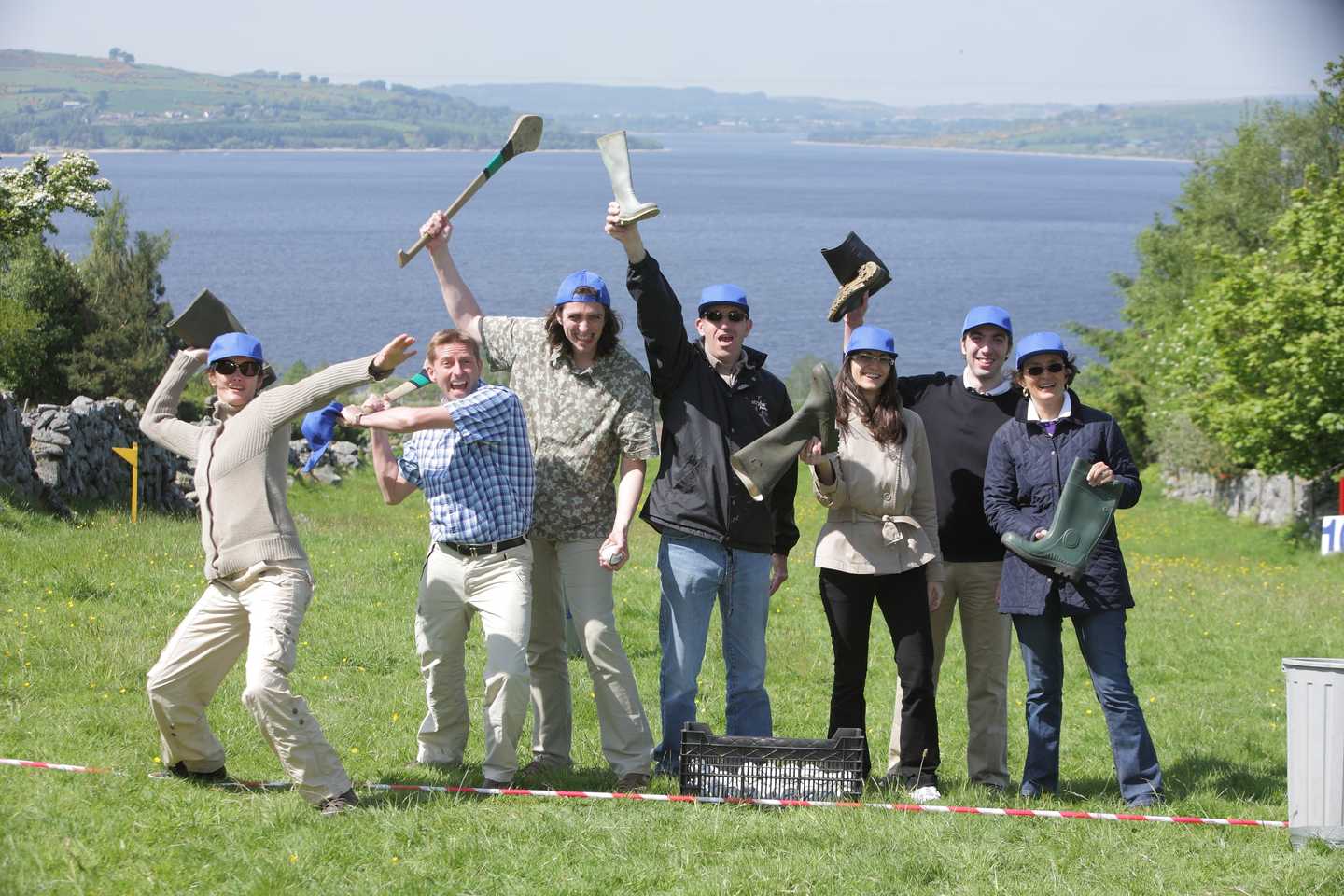Corporate team outdoors celebrating after Irish-themed team building games