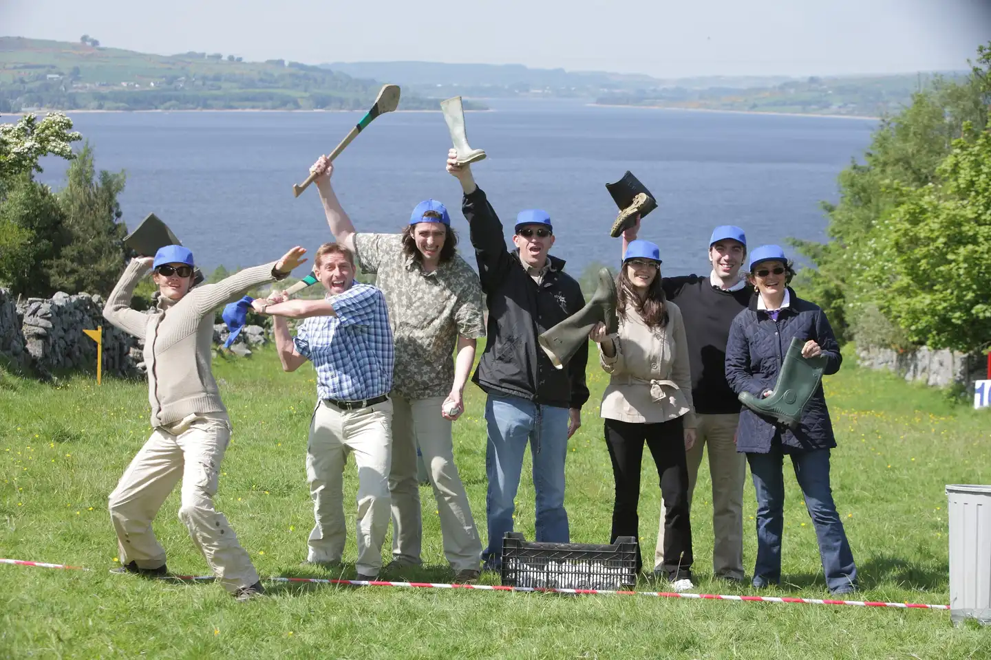 Corporate team outdoors celebrating after Irish-themed team building games