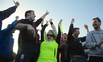 people celebrating doing an outdoor team building activity in ireland