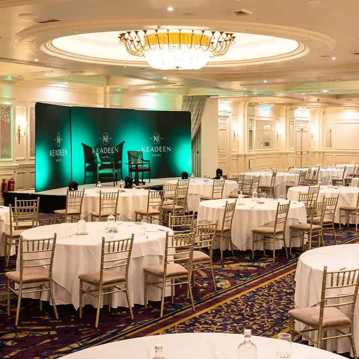 Corporate event room with stage and banquet seating at The Keadeen Hotel in Newbridge, County Kildare