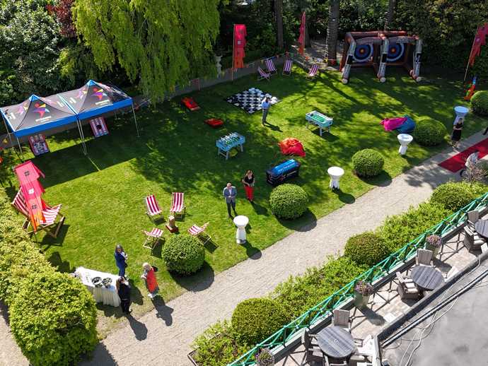 Outdoor Summer Party setup on green grass with Dynamic Events Marquees and team games