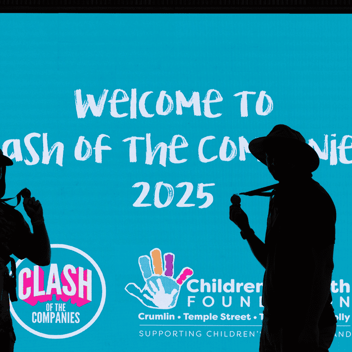 People posing infront of COTC signage