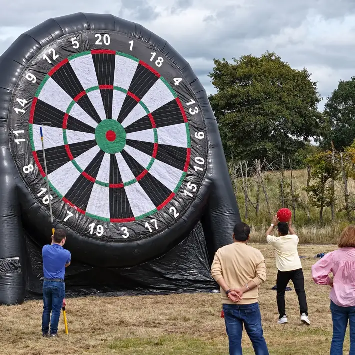 Moore Ireland staff playing giant inflatable darts at summer team building event at Heritage Hotel Killenard with Dynamic Events Ireland