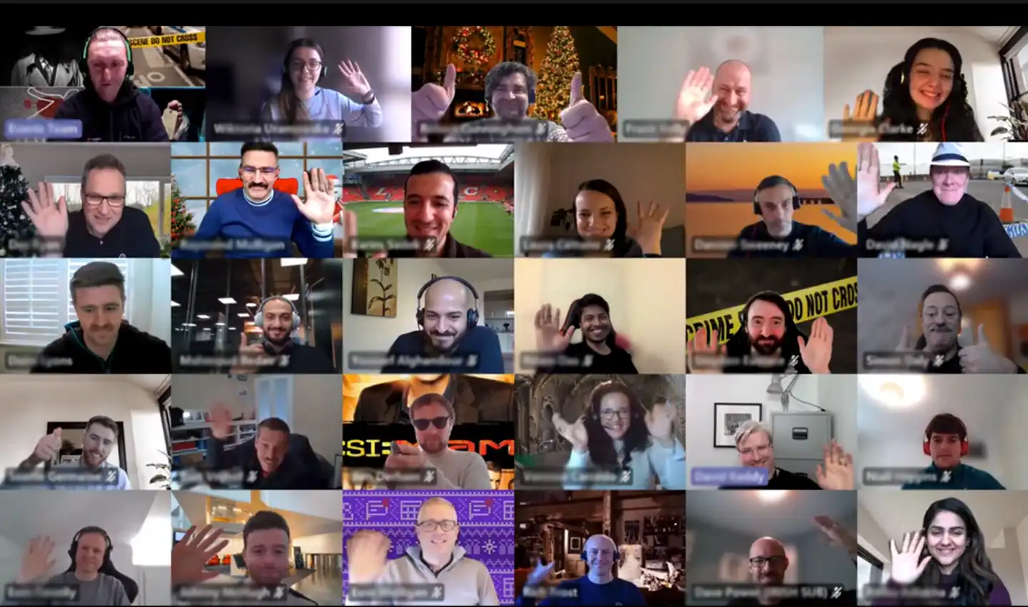 Corporate virtual murder mystery team building event with multiple participants smiling and waving on a video call, ideal for in person and online team activities in Ireland.