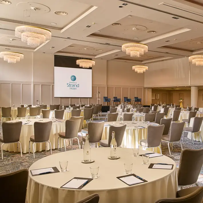 Large conference space at Limerick Strand Hotel in cabaret setup for business presentations