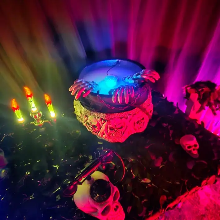 witches cauldron with blue lights and smoke