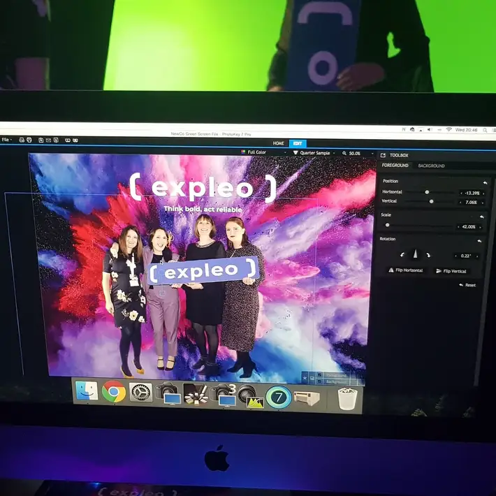 computer screen running green screen photo software at launch event