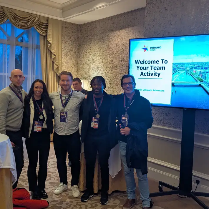 Team smiling after winning the challenge