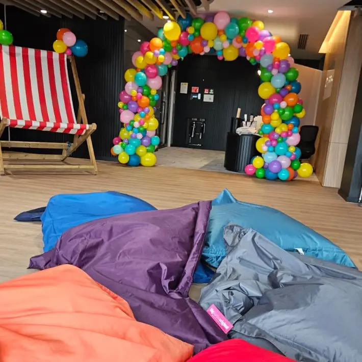 bean bags and balloon arch 