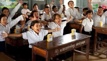 Children celebrating after receiving SolarBuddy lights in Cambodia