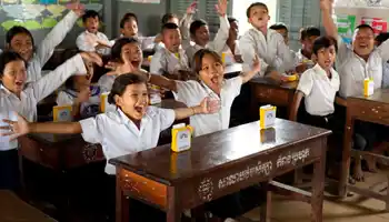 Children celebrating after receiving SolarBuddy lights in Cambodia