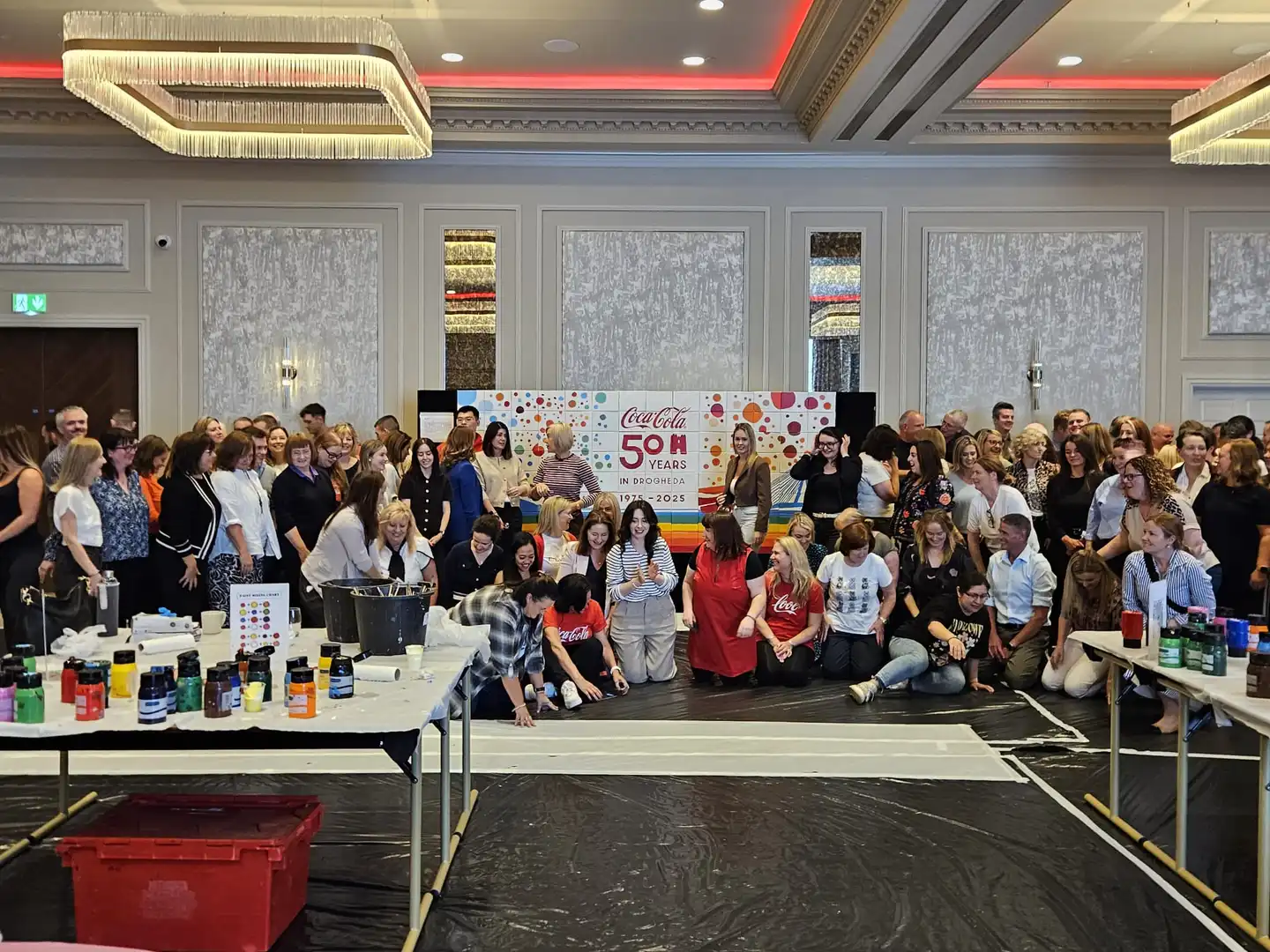 Coca-Cola team taking part in a Big Picture team building painting activity at Johnstown Estate to celebrate 50 years in Drogheda with Dynamic Events Ireland.