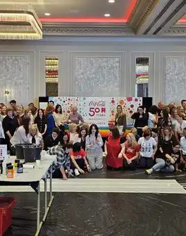 Coca-Cola team taking part in a Big Picture team building painting activity at Johnstown Estate to celebrate 50 years in Drogheda with Dynamic Events Ireland.