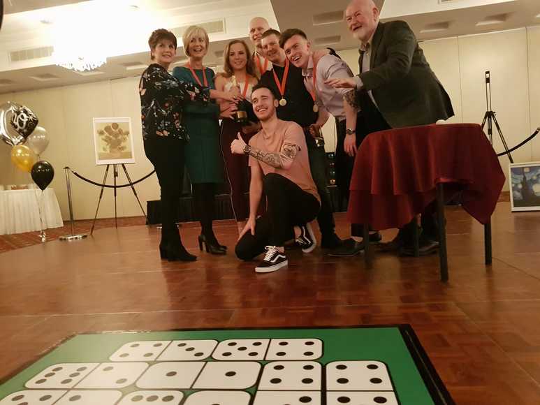 winning team celebrating escaping during team building activity corporate event