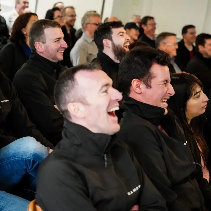 group laughing at a team building event