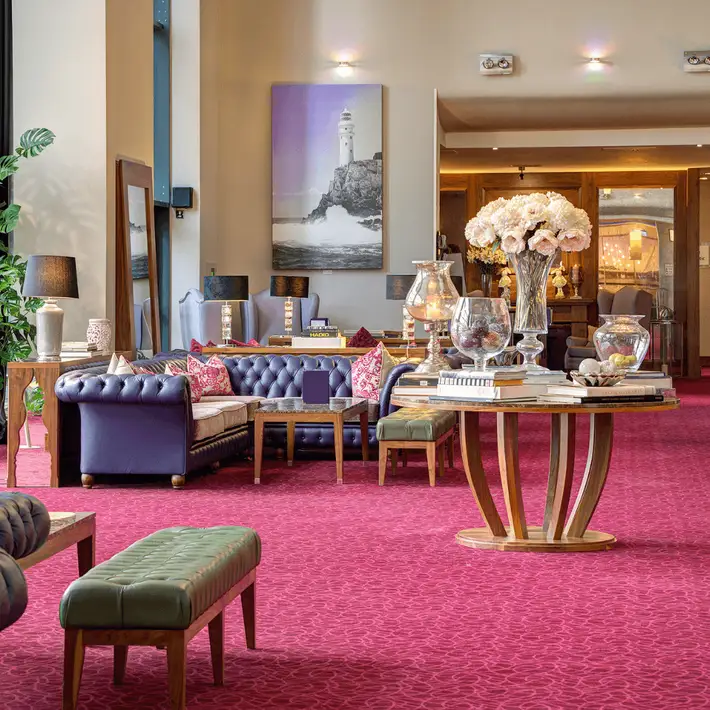 Lobby area with red carpet and couches