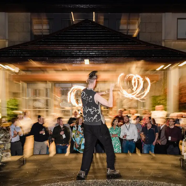 Fire performer entertaining crowd at evening company away day evening entertainment celebration