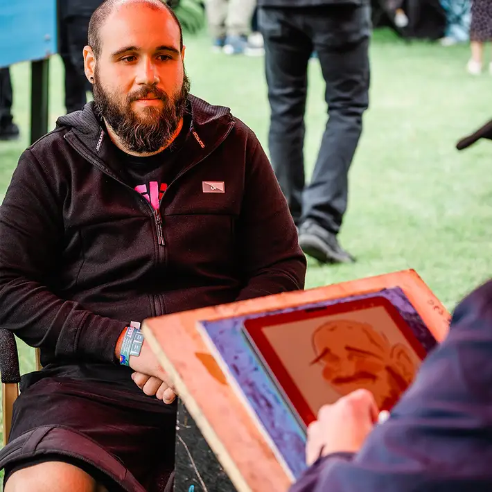 digital caricature being drawn live on iPad during corporate team building activity in Ireland