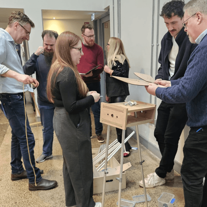 people working on creating the wind mill