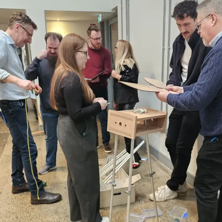 people working on creating the wind mill