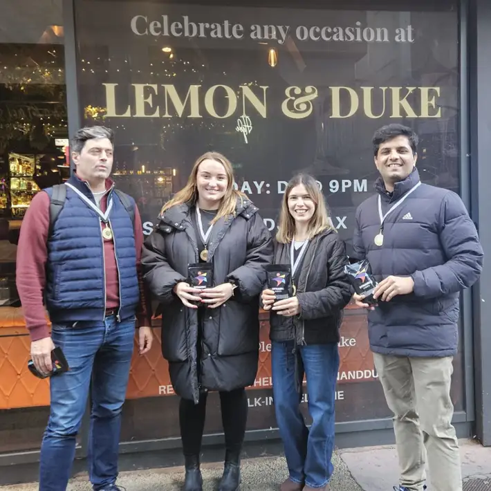winning team smiling outside lemon and duke