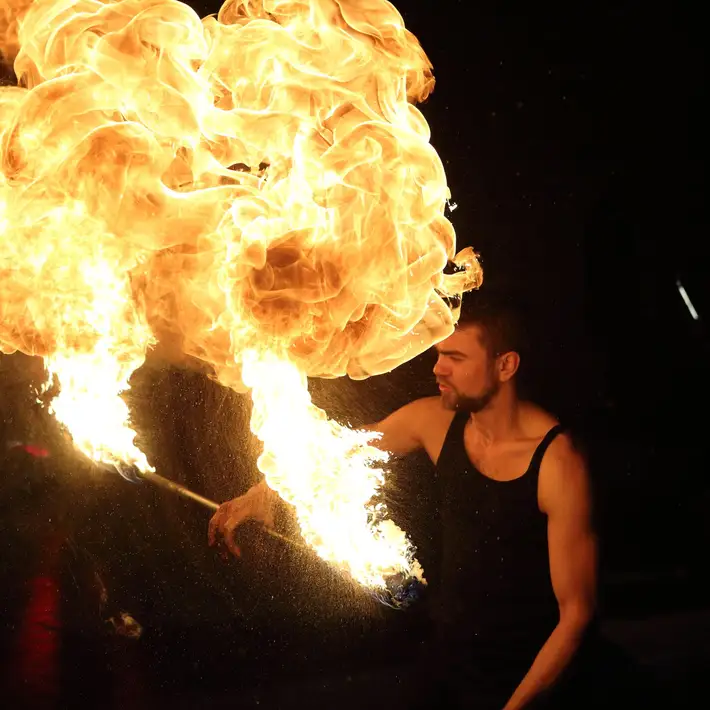 Spectacular fire performer at Irish corporate awards night creating dramatic entertainment for guests.