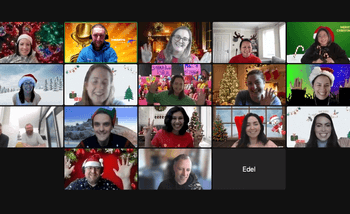 Corporate team on a virtual Christmas party call with festive backgrounds and Santa hats, hosted online for remote teams in Ireland and abroad