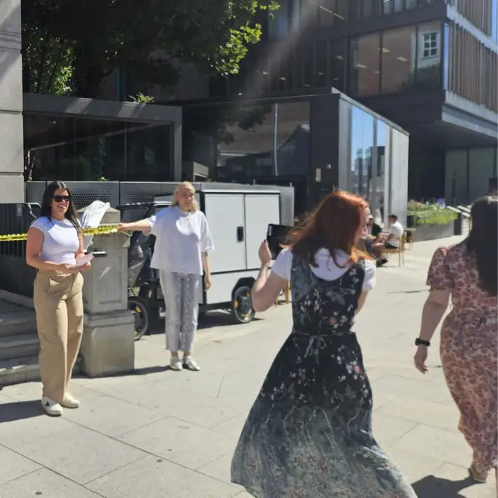 participants setting up the outside of a crime scene to act as a new s anchor to announce the breaking news 