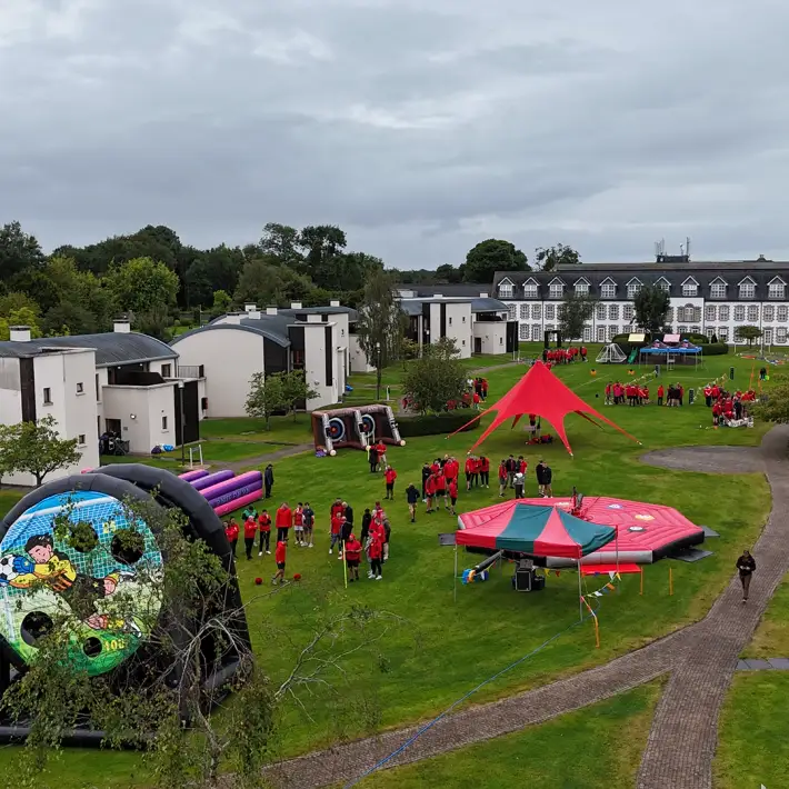 Drone shot of Hilti Ireland Summer Party 2025 with outdoor team building activities and staff in red uniforms