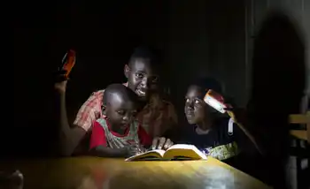 A family living in energy poverty with solarbuddy lights built by corporates in ireland