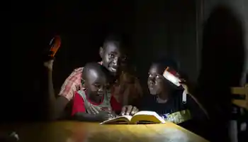 A family living in energy poverty with solarbuddy lights built by corporates in ireland