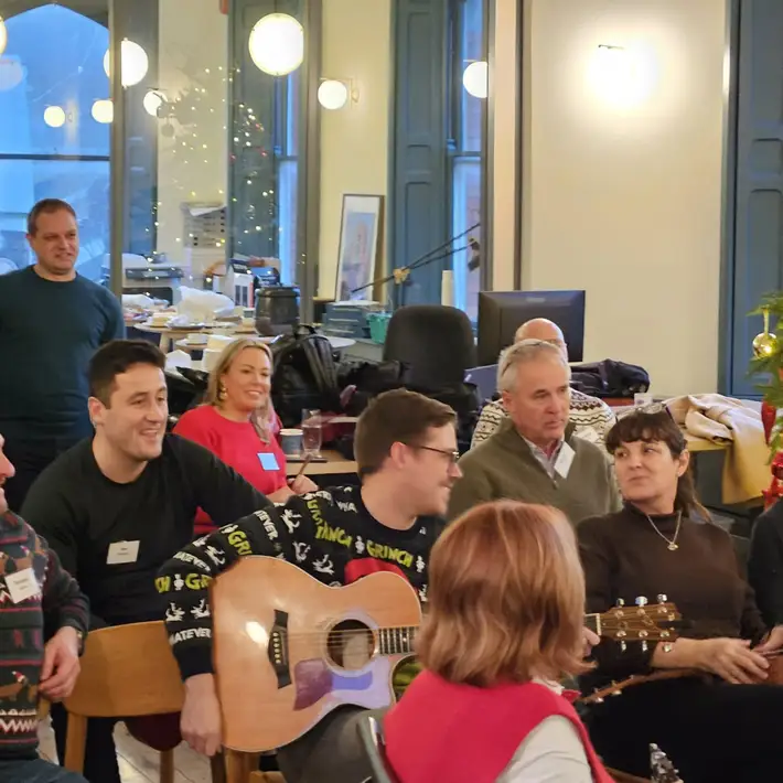 Group playing the guitar with various instruments