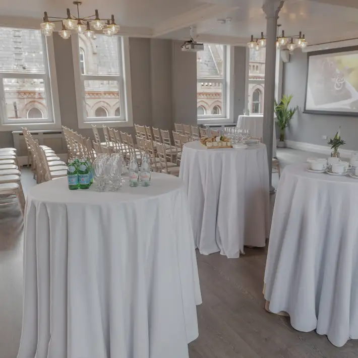 Plan your corporate team building session at Fallon & Byrne overview set up for a conference with pod tables | Dynamic Events