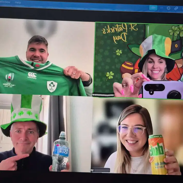 Happy team doing st patricks day team building quiz for corporates