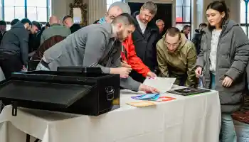 Corporate team building activity in Ireland with colleagues solving the Code Breaker indoor challenge