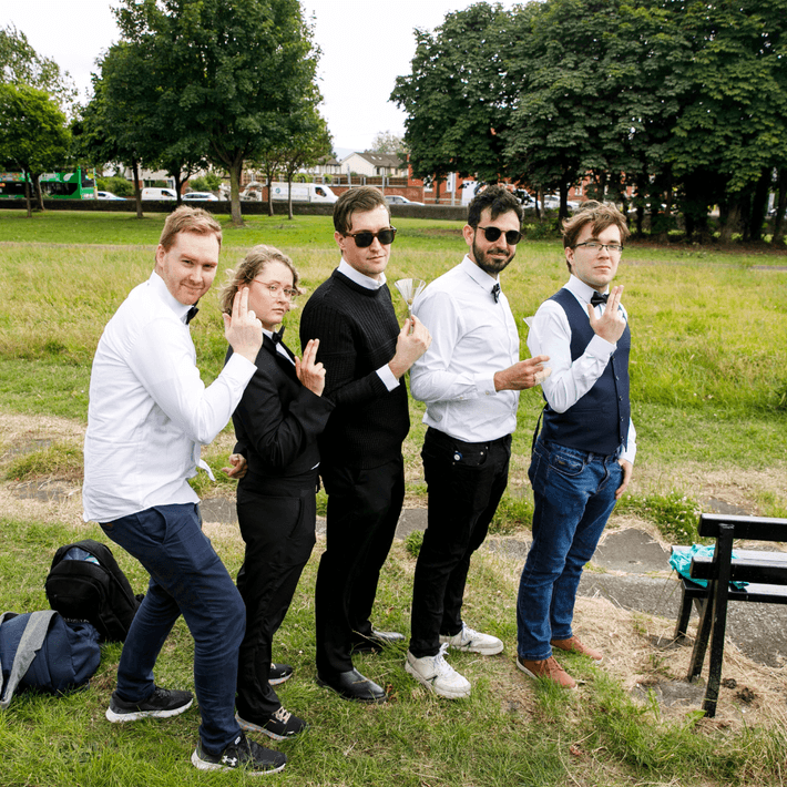 Office team taking part in a Halloween treasure hunt around city streets.